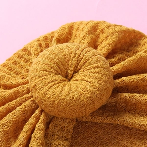 Ginger yellow waffle knit baby beanie hat with a cute donut decorative ring on top