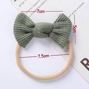 Detailed view of green waffle knit bow headband with elastic nylon band and dimensions