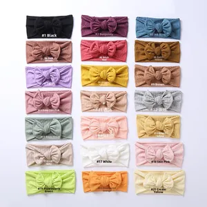 Detailed grid showing 21 colors of jacquard knit baby headbands with bow accents