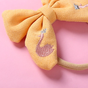 Bandeau bébé jaune avec nœud gaufré et broderie fine de cygne rose pour enfants