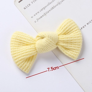 Cute light yellow knitted bow hair clip for girls with 7.5cm waffle knit texture