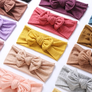 Close-up of baby jacquard headbands with ribbed knit texture and large bow details