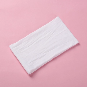 Detailed texture of ultra-soft white nylon headband for babies with flexible fabric
