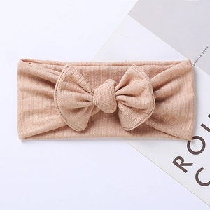 Detail of baby jacquard bow headband showing soft ribbed knit texture and stretchable fabric