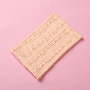 Detailed close-up of soft jacquard nylon baby headband with knitted texture pattern