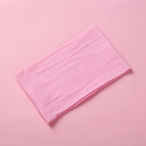 Close-up of soft pink nylon fabric texture for baby headband and hair accessories