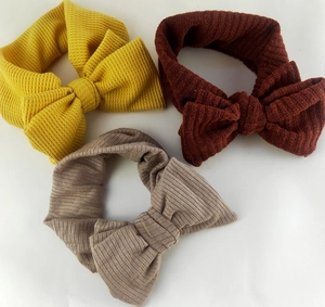 Detail showing waffle texture and ribbed fabric on elastic double bow baby headbands