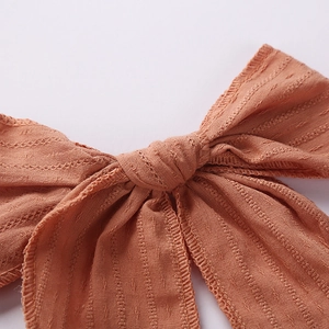 6 inch orange jacquard cotton oversized bow hair clip with textured swallowtail design