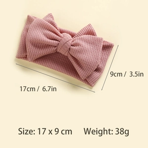 Detail showing 17x9cm size specifications and waffle knit texture of pink baby bow headband