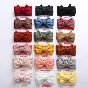 Detailed grid view of 18 different colored waffle knit baby headbands with large bows