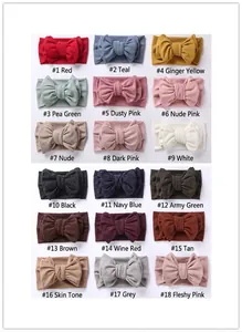 Macro detail of ribbed knit texture on kids bow headbands in eighteen assorted colors