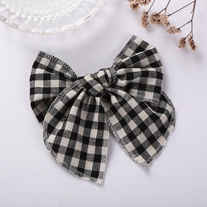 Barrette à cheveux avec nœud à carreaux noir et blanc pour petite fille style chic