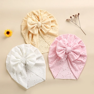 Three-pack baby lace turbans with large bows in cream, pink, and white embroidered fabric