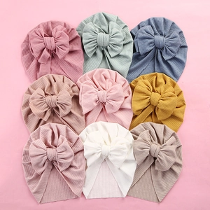 Baby ribbed turban hats with oversized bows in nine soft assorted colors for infants