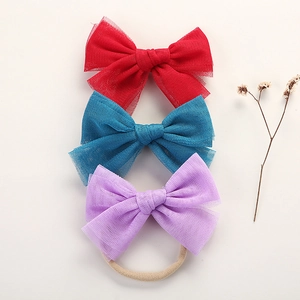Set of 3 nylon baby headbands with soft mesh bows in red, blue, and purple colors