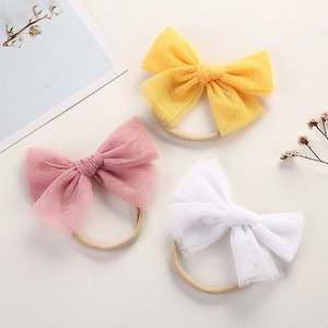 Set of 3 soft nylon baby headbands with large mesh bows in yellow, pink and white