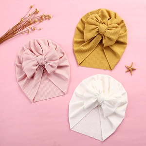 Detailed view of high-elasticity ribbed fabric baby turban hats with oversized bows