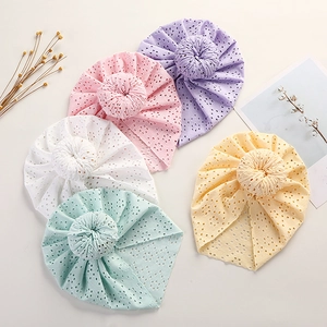 Baby donut turban hats with eyelet lace embroidery in pink, purple, white, mint, and yellow