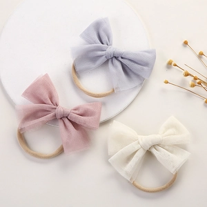 Set of 3 soft mesh bow nylon headbands for babies in blue, pink, and cream colors