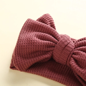 Handmade waffle texture baby headband with a large dark red bow for infant girls