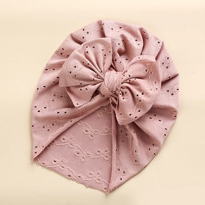 Lace hollow baby turban hat with large double bow in soft dusty pink knit fabric