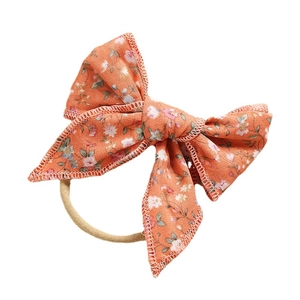 Fascia per neonati con fiocco in cotone a fiori arancioni e morbido nylon elasticizzato