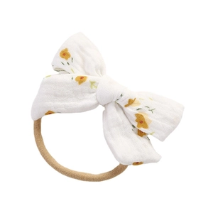 Bandeau bébé en mousseline de coton avec nœud à fleurs jaunes et élastique souple