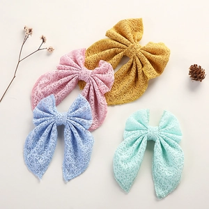 Set van vier kanten strik haarclips voor meisjes in diverse pastelkleuren