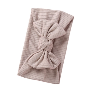 Elastic ribbed knit baby headband with large double-layered bow in soft dusty pink