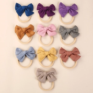 Set of 10 linen bow nylon headbands for newborn babies in various earthy colors