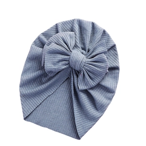 Soft ribbed baby turban hat featuring a large 3D bow in a dusty blue morandi tone