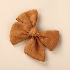 Barrettes à nœud en lin et coton pour filles de couleur jaune moutarde et texture naturelle
