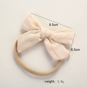 Detailed macro view showing the 8.5cm cotton bow texture and dimensions of baby headband