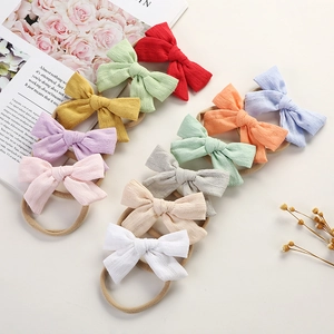 Detailed set of 10 colorful cotton bow headbands for babies with soft nylon bands