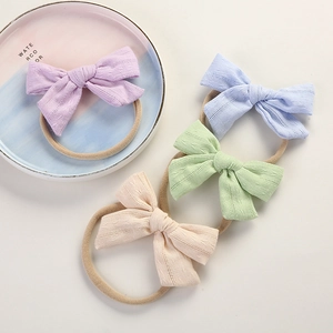 Handmade cotton bow headbands for babies in pastel colors with high elasticity