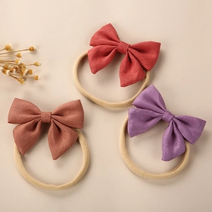 Linen baby bow headband set in dark red, tan, and mauve with elastic nylon bands