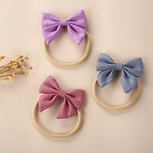 Three-piece linen bow headbands in lavender, grey blue and dusty pink for baby girls