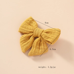 Pince à cheveux nœud en gaze de coton jaune pour filles avec détail de taille 8cm