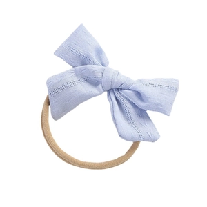 Blue fabric bow headband for babies with breathable texture and soft nylon elastic band