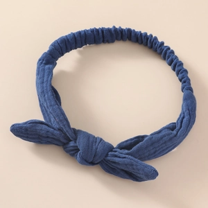 Detailed texture of navy blue cotton baby headband with soft rabbit ear knot design