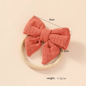 Soft cotton bow headband for newborns with highly elastic nylon band in orange