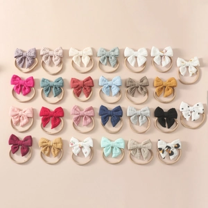 Bulk set of 27 colorful cotton bow headbands for newborns with soft nylon elastic bands