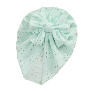 Mint green eyelet embroidered baby turban hat with a large decorative front bow