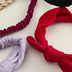 Set of four cotton gauze knotted headbands for baby girls in red, purple, burgundy and black