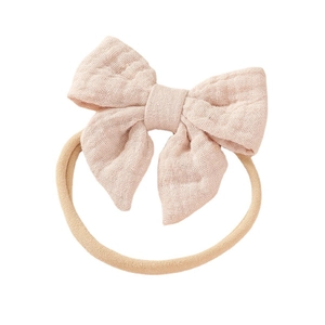 Soft cotton bow baby headband with elastic nylon band for newborns in light pink