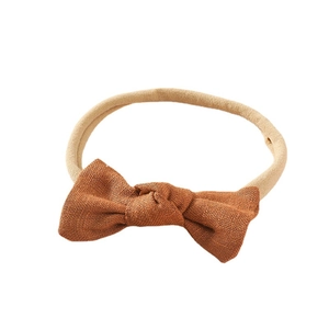Bandeau bébé en lin avec nœud rouge rouille et ruban élastique en nylon souple
