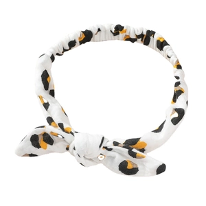 Elastic baby headband with leopard print bow design made of soft cotton fabric