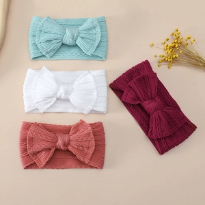 Detailed knit texture and oversized bow designs on elastic jacquard nylon baby headbands