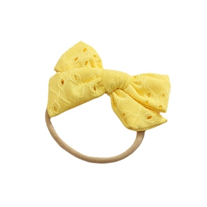 Bandeau bébé jaune avec nœud en dentelle brodée et matière en nylon extensible