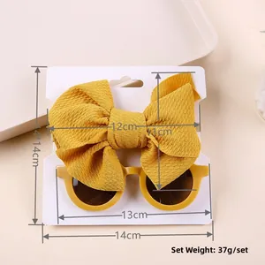 Detailed size view of yellow bow headband and round sunglasses set for baby girls
